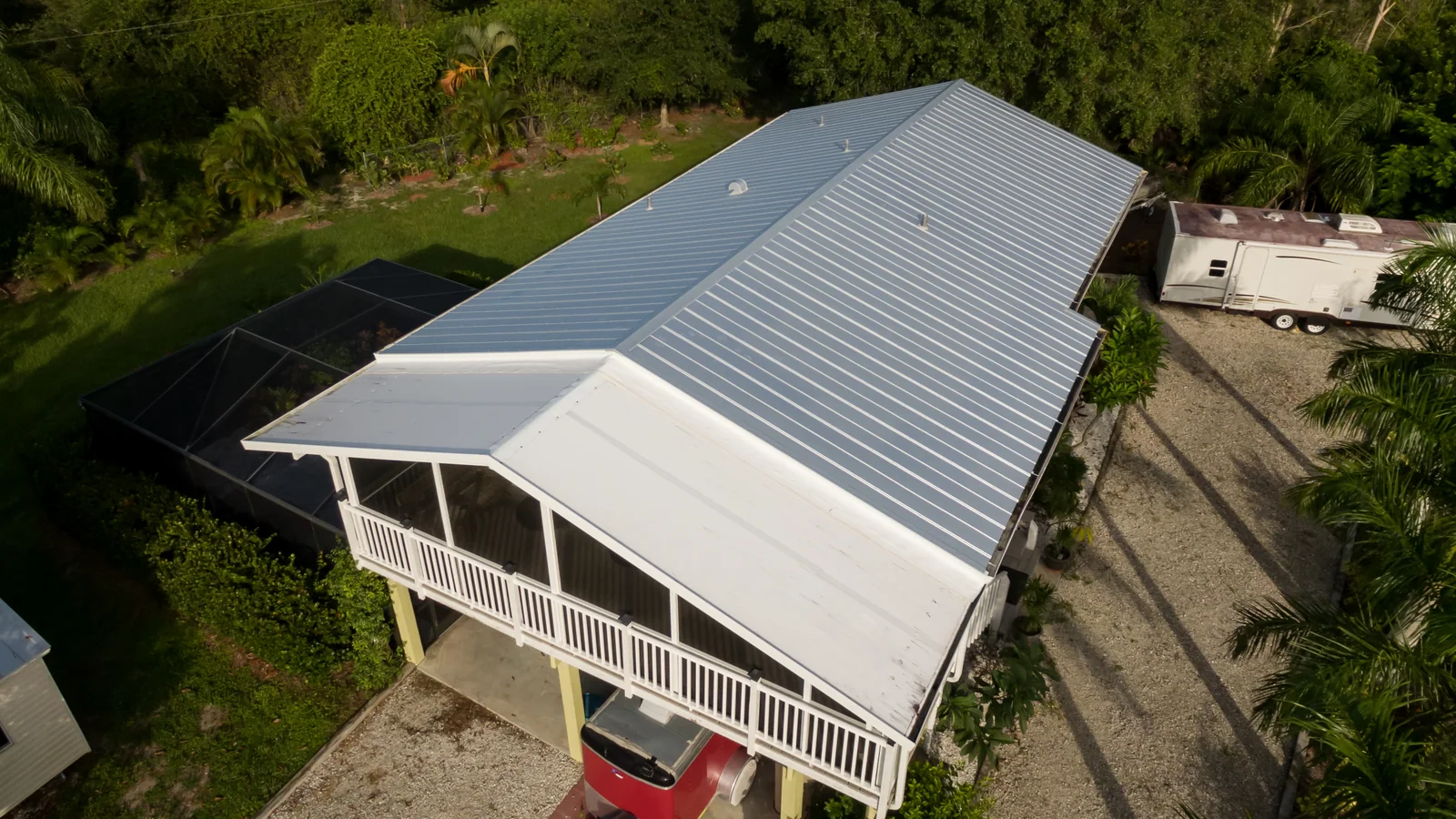 Metal roofing across the main roof and lower roof slopes, Bokeelia