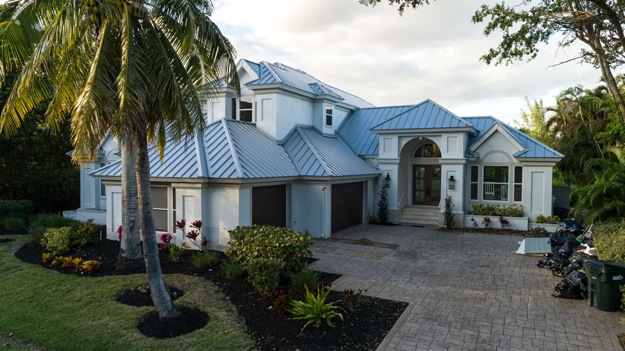 Metal panels across the front roof slopes