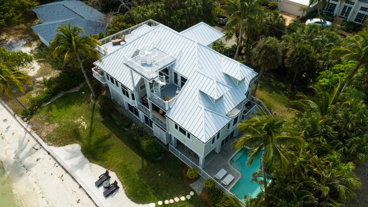 Aerial view of metal roofing on a waterfront home