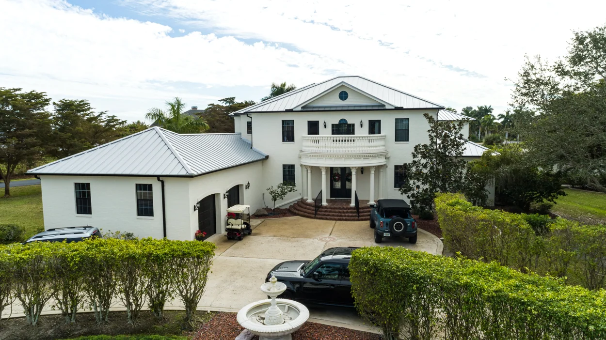 Metal roofing across a home and separate garage