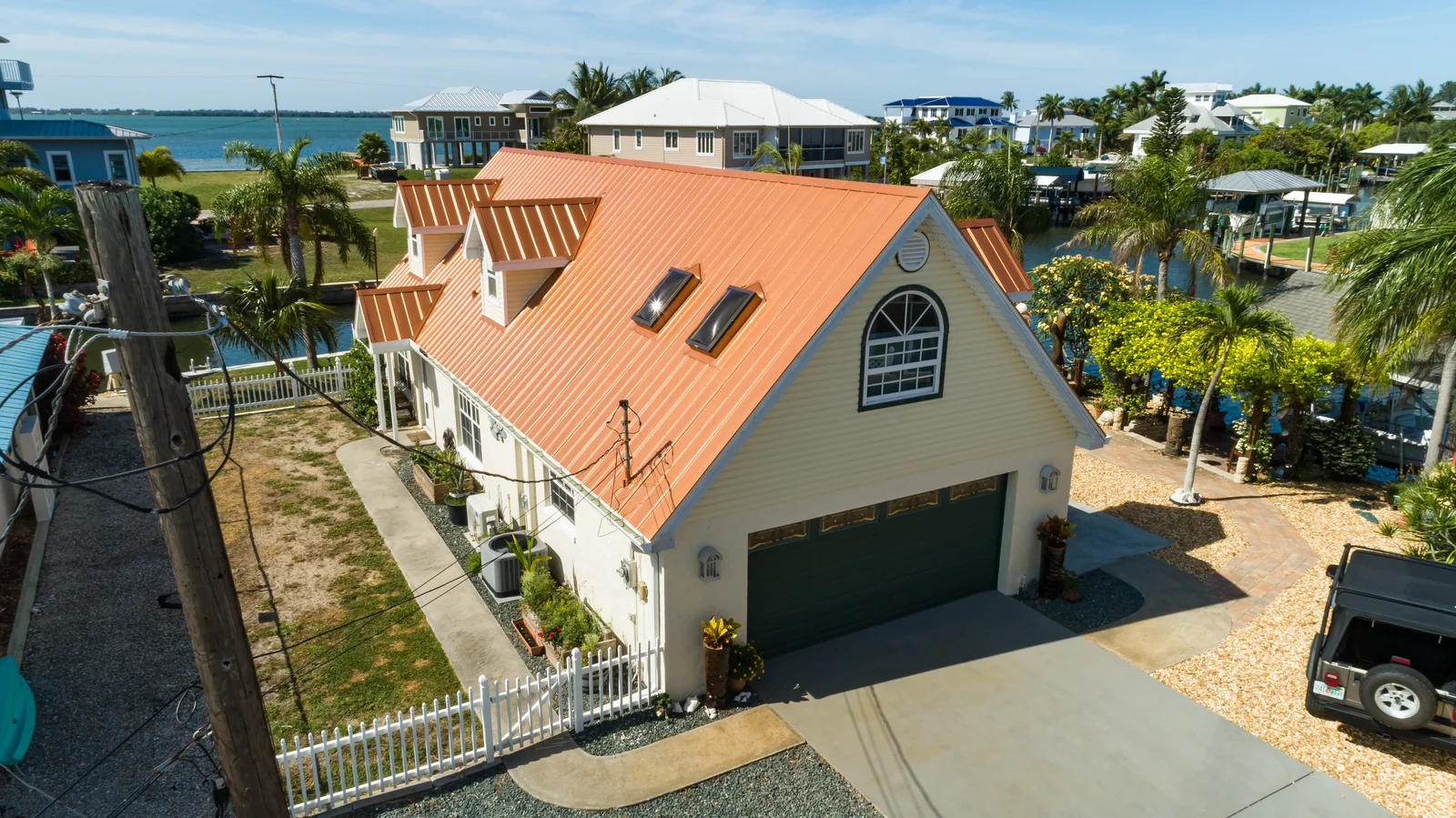 Orange metal panels across a gabled roof, St. James City