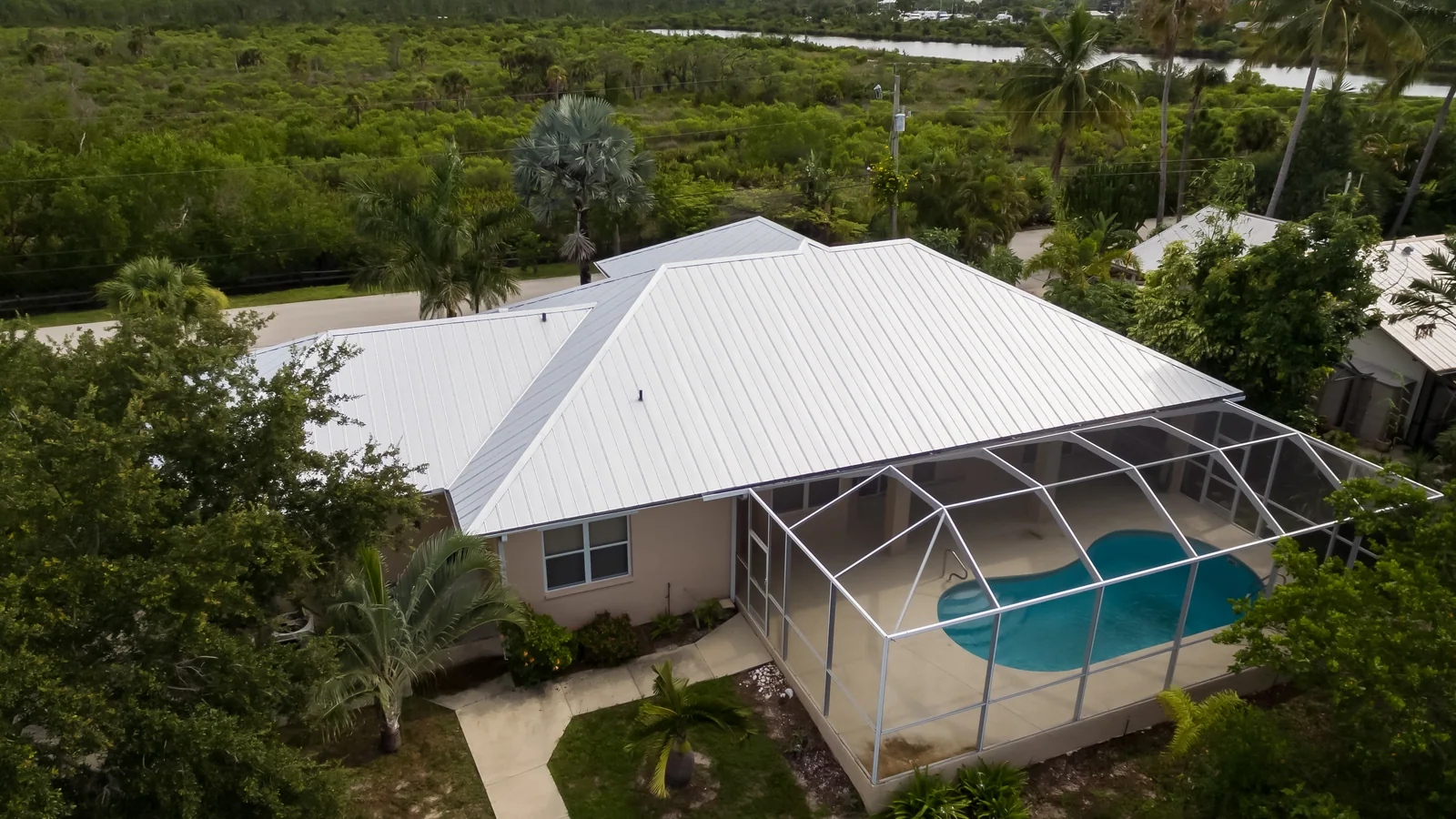 Aerial view of metal roofing and intersecting roof sections, St. James City