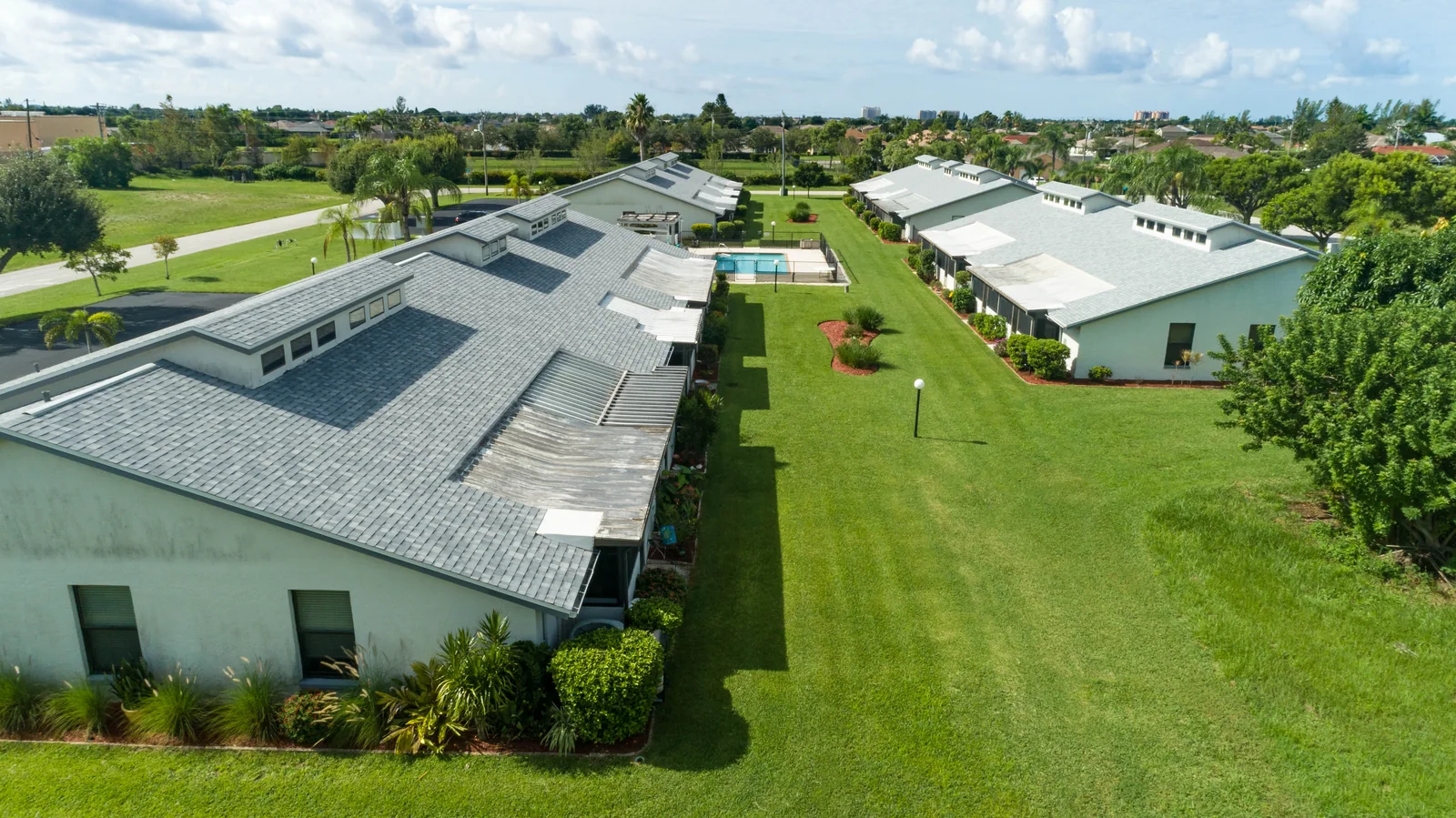 Shingle roofing across courtyard buildings