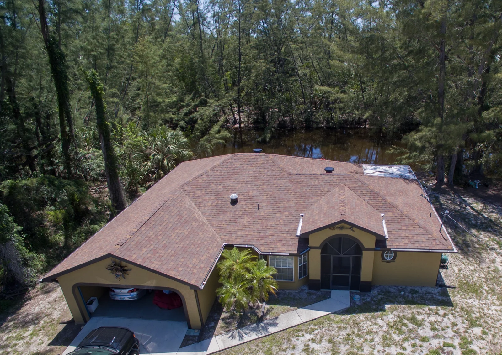 Shingle roofing across intersecting hips and gables