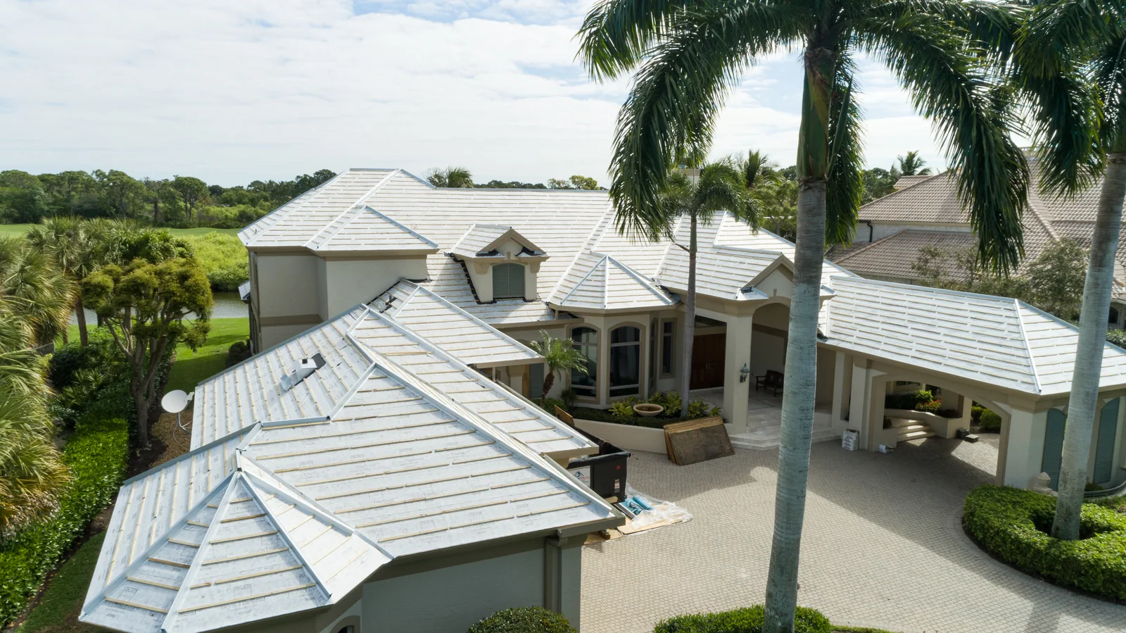 Light-colored tile roofing across a complex roofline, Bonita Springs